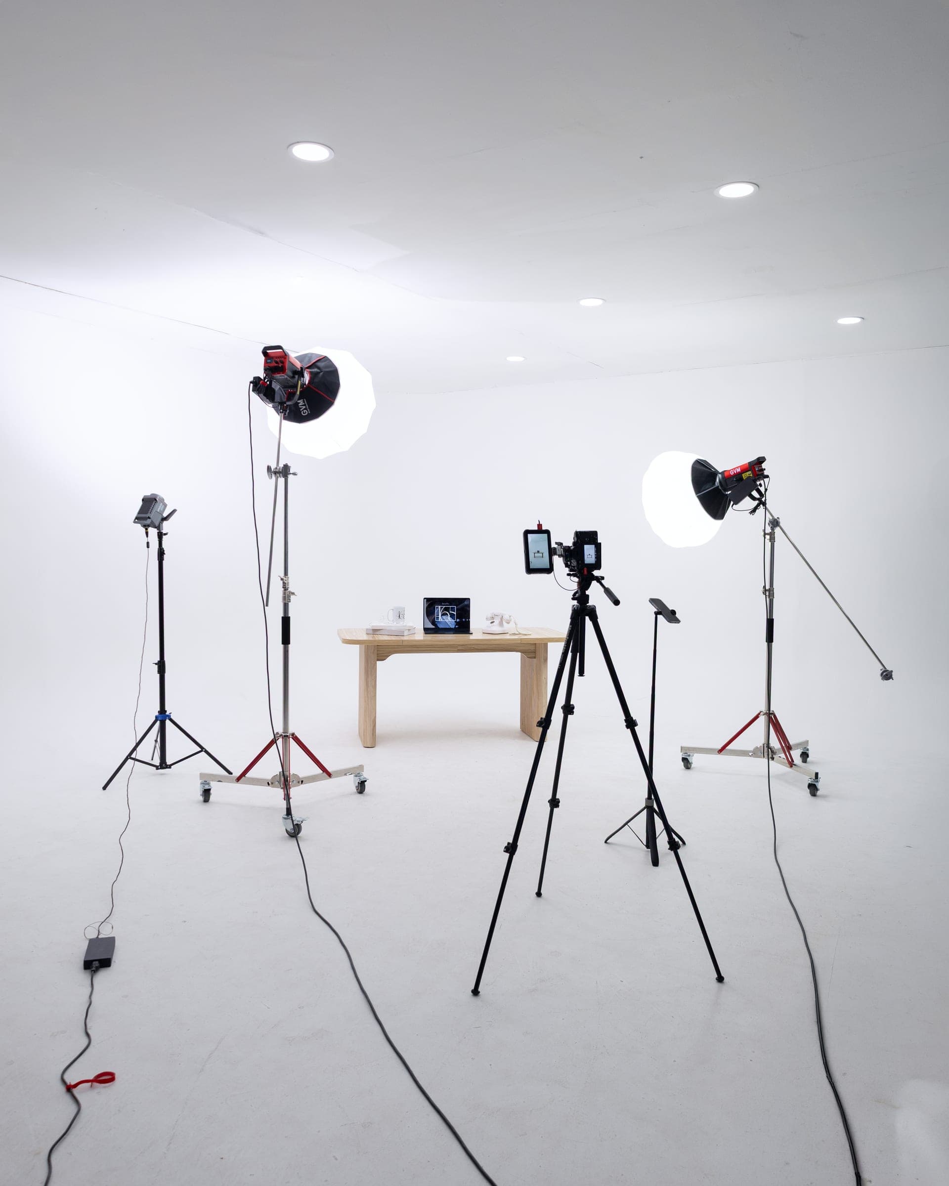 Lights and cameras arranged around a set inside the 465 production studio